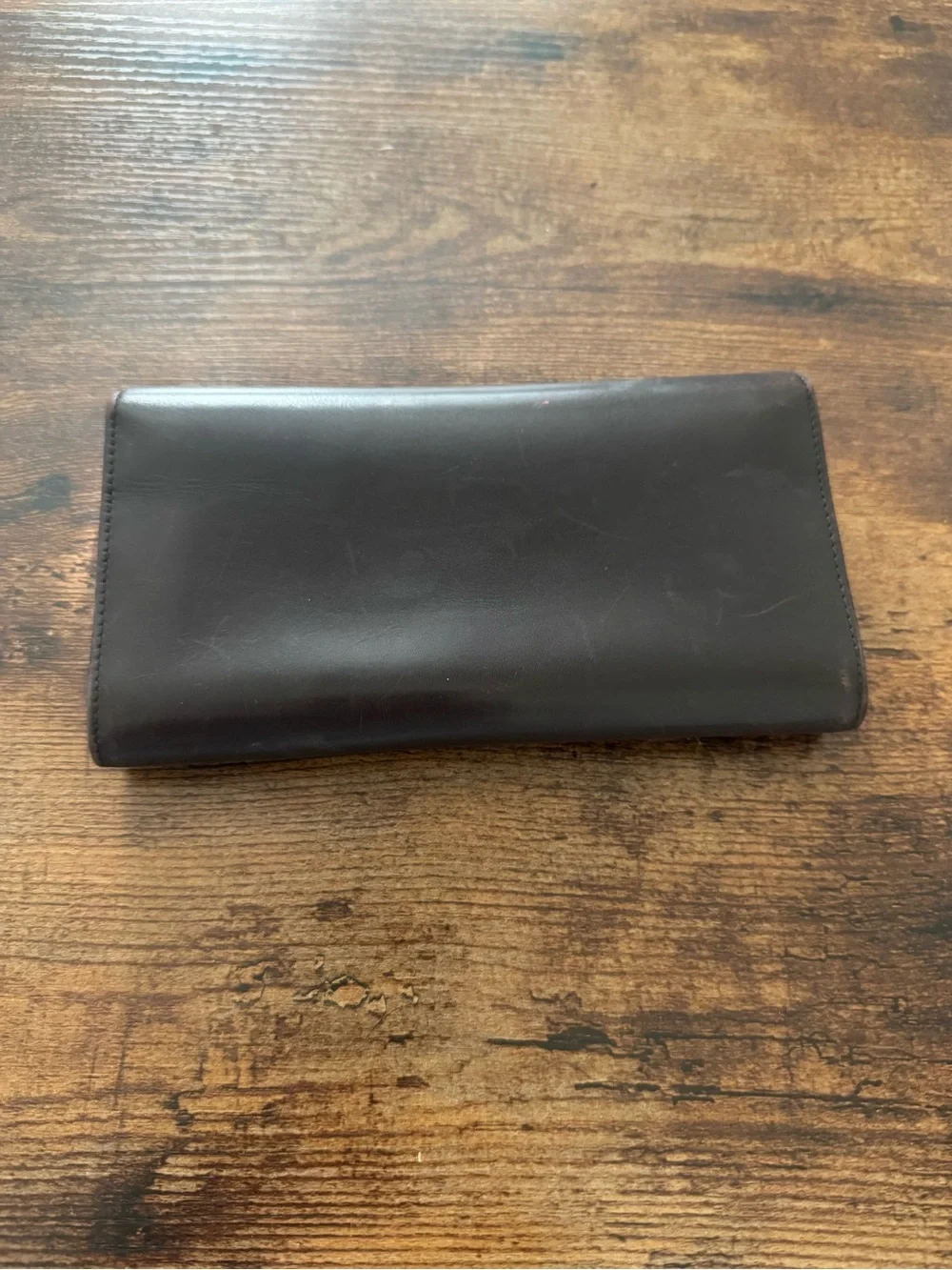 Dark Brown Coach Wallet with lots of card space, never used but has scratch